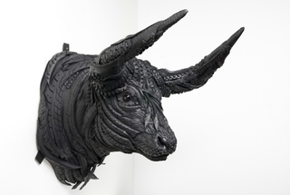 Illustration for article titled This Artist Turns Old Tires Into Dark, Disturbing Nightmare Monsters